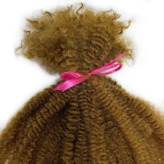 Woman braiding in hair extensions – step by step process